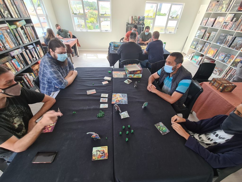 People sitting at tables playing